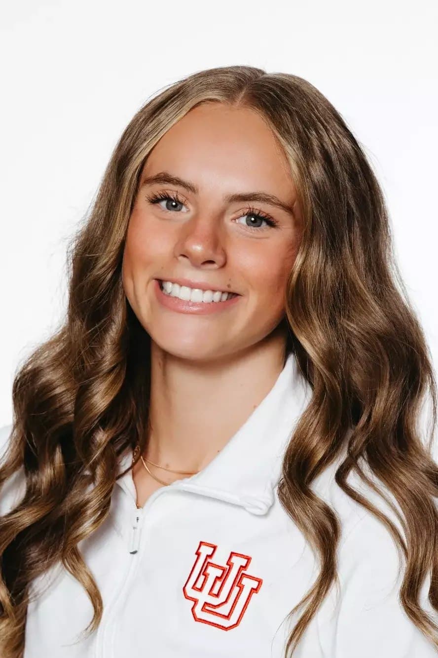 Official University of Utah roster headshot of gymnast Camie Winger in a white Utah jacket.