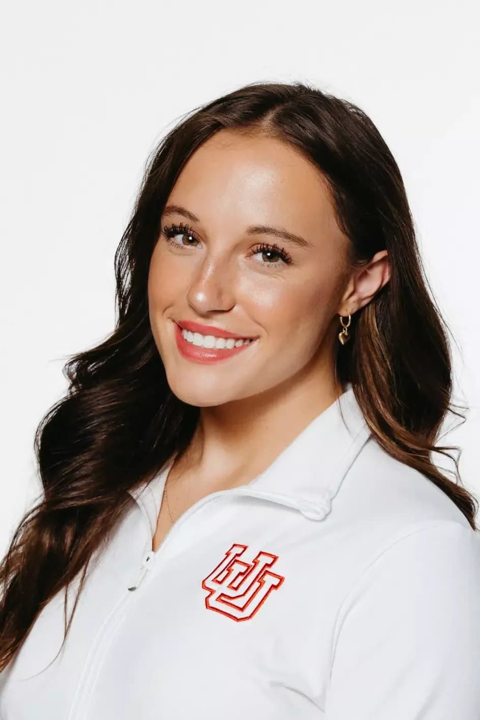 Official University of Utah roster headshot of gymnast Ella Zirbes in a white Utah jacket.