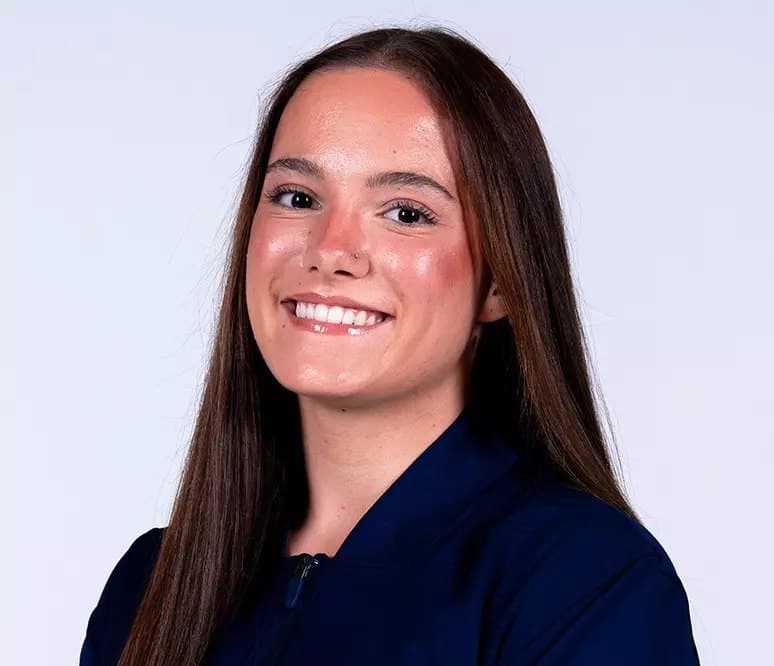 Official Utah State roster headshot of gymnast Mya Witte in a navy Utah State jacket.