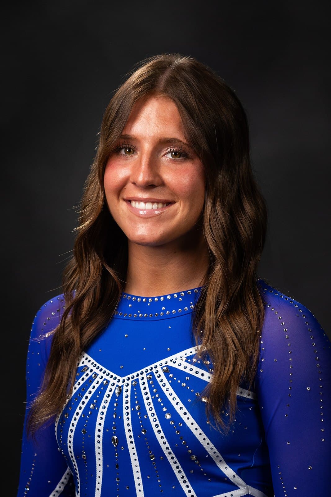 Official BYU roster headshot of gymnast Scarlett Sonnenberg in a royal-blue BYU leotard.