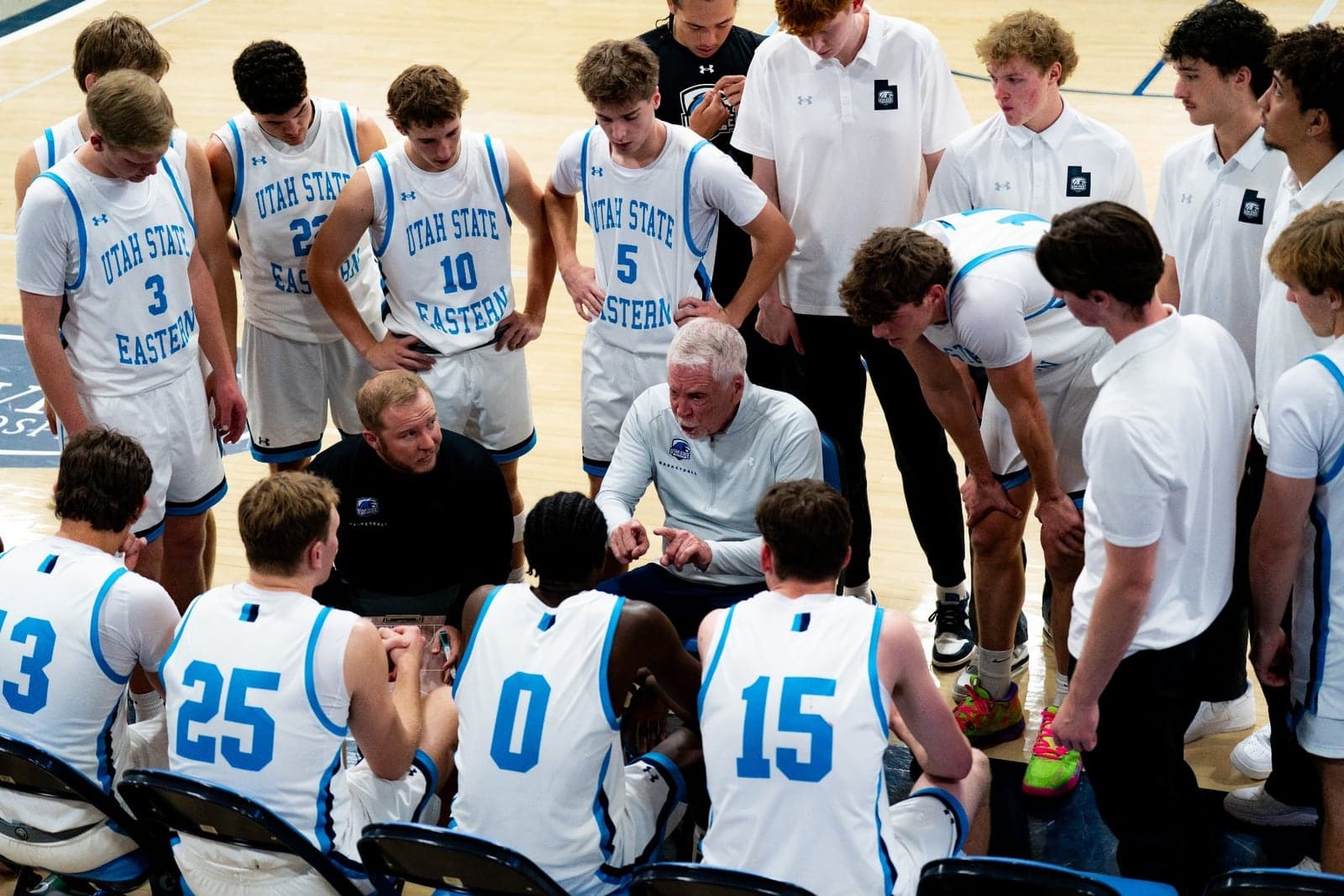 USU Eastern coaches Evans and Ralphs talk to their players during a timeout.