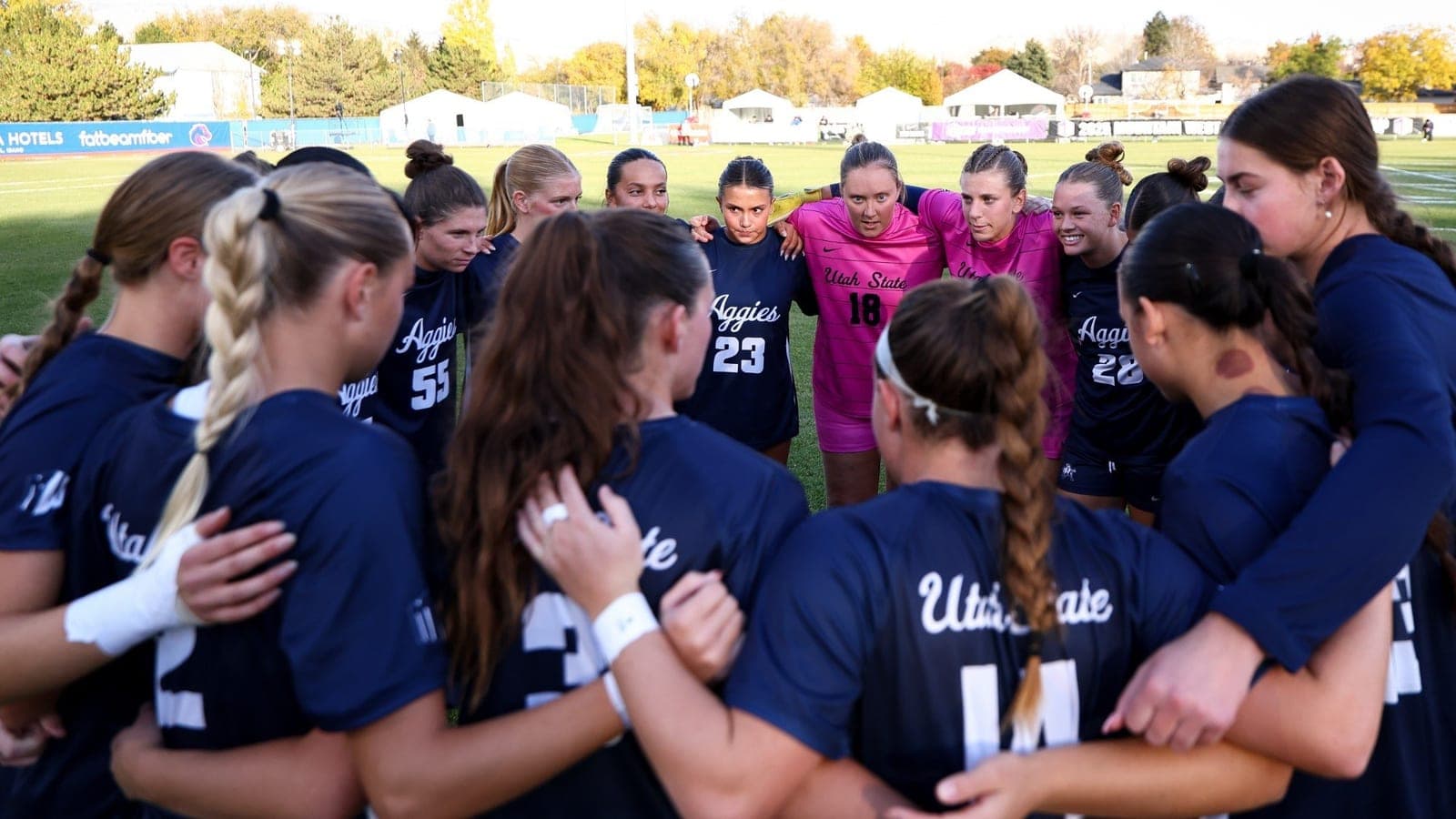 Utah State women's soccer players huddle in an official Utah State Athletics image released with the 2026 nonconference schedule.