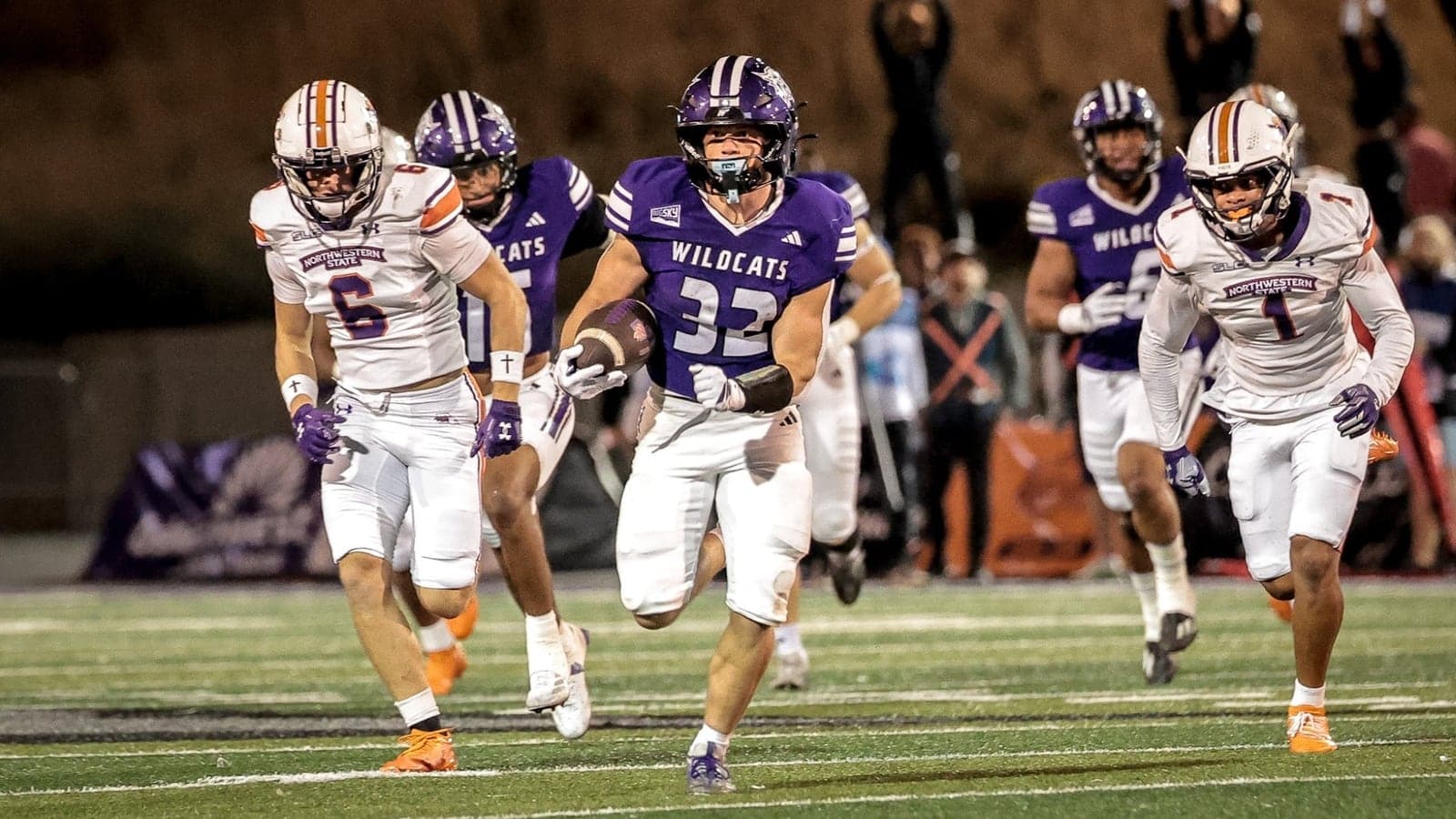 Weber State running back Seth Rigtrup carries the ball against Northwestern State.
